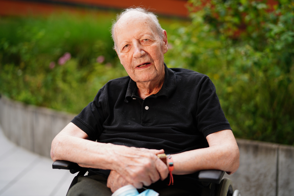 Senior gentleman resting peacefully in a garden