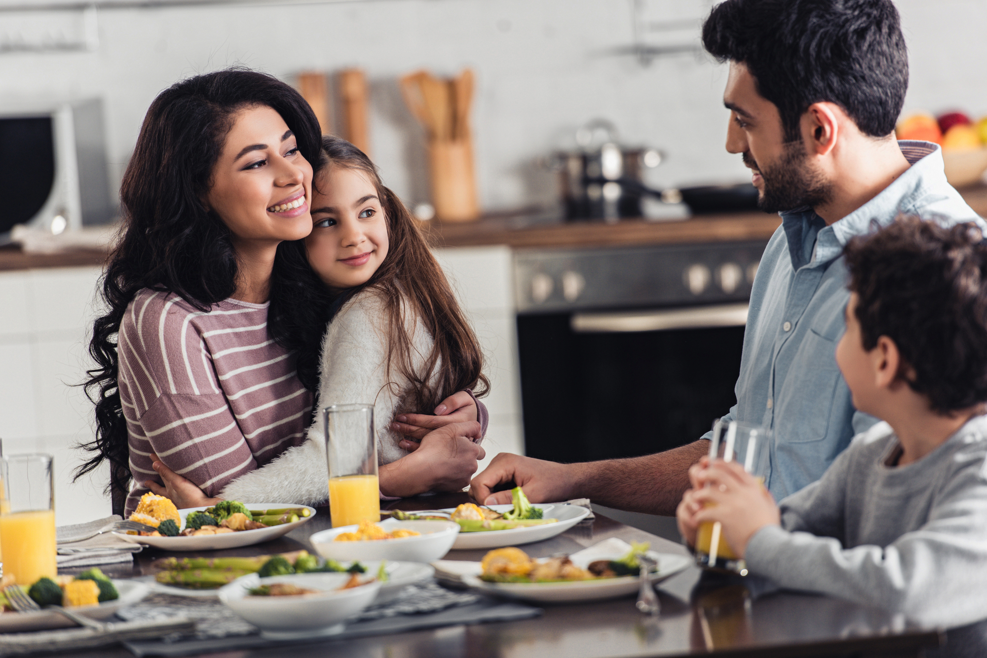 Family sharing a warm meal together at home